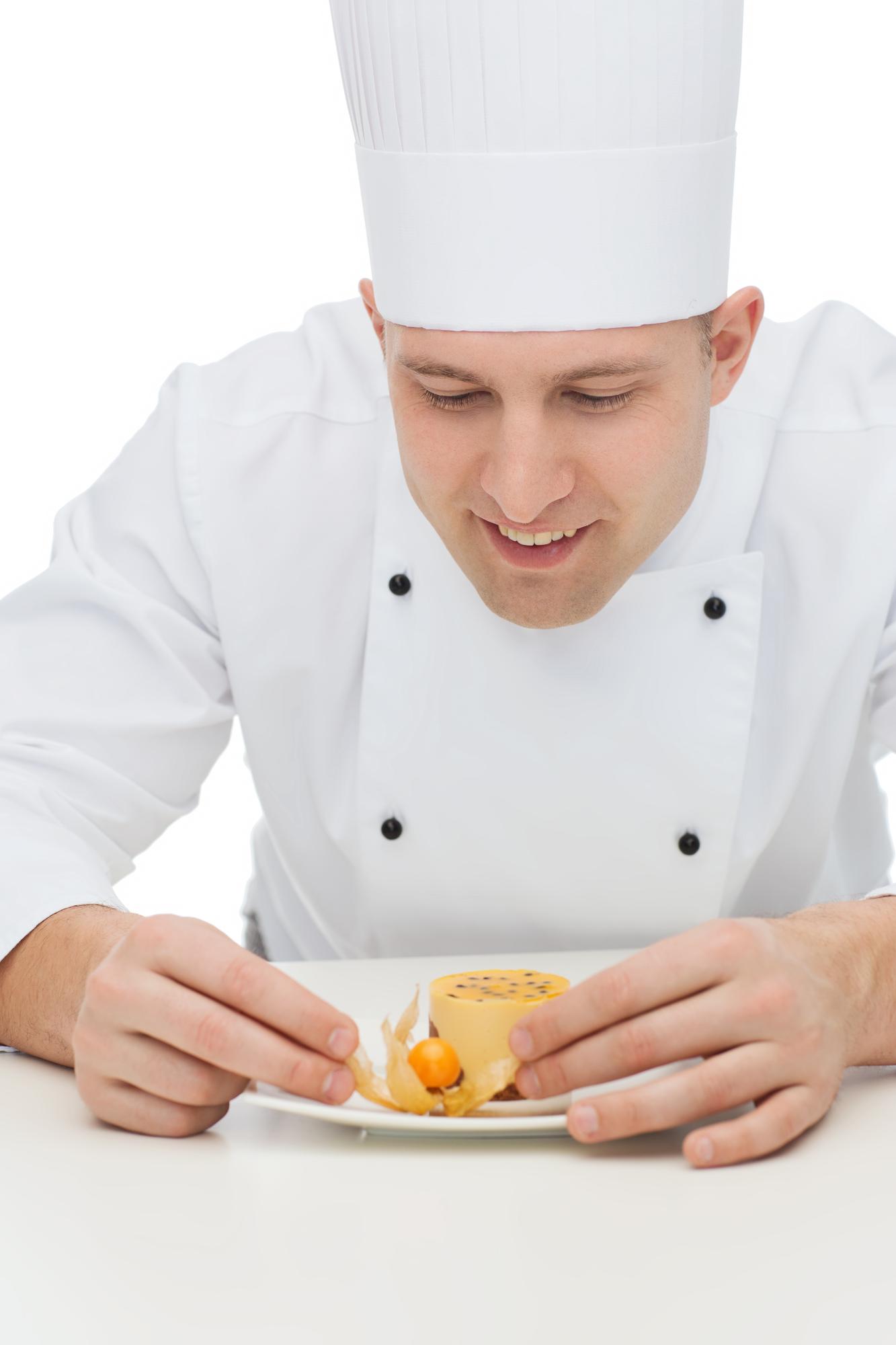 Chef demonstrating plating technique in a workshop